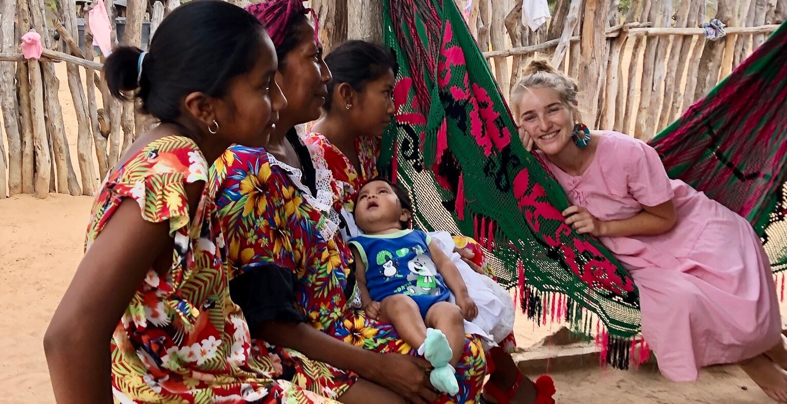 Wayuu women and cofounder sitting in a traditional "chinchorro" hammock 
